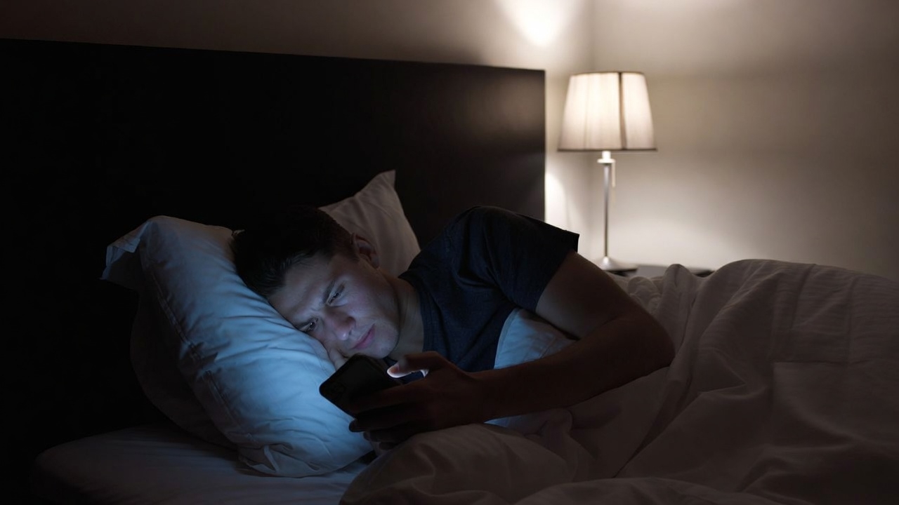 Using mobile phone in bed at night before sleeping
